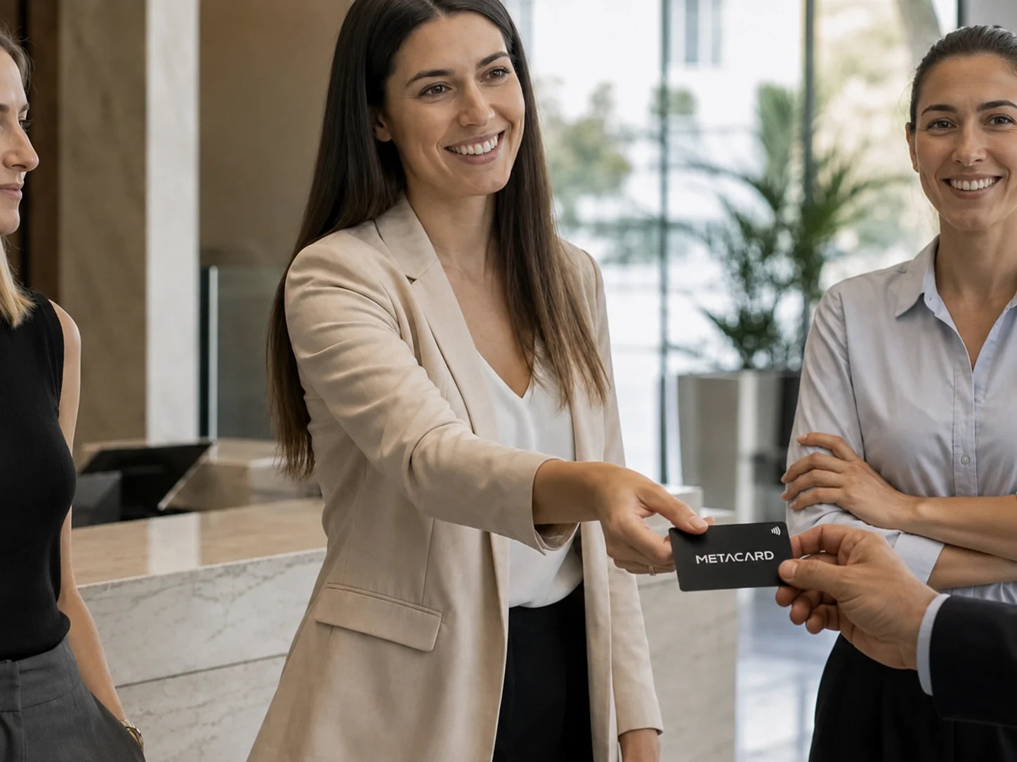 A professional hands over a black METACARD NFC business card